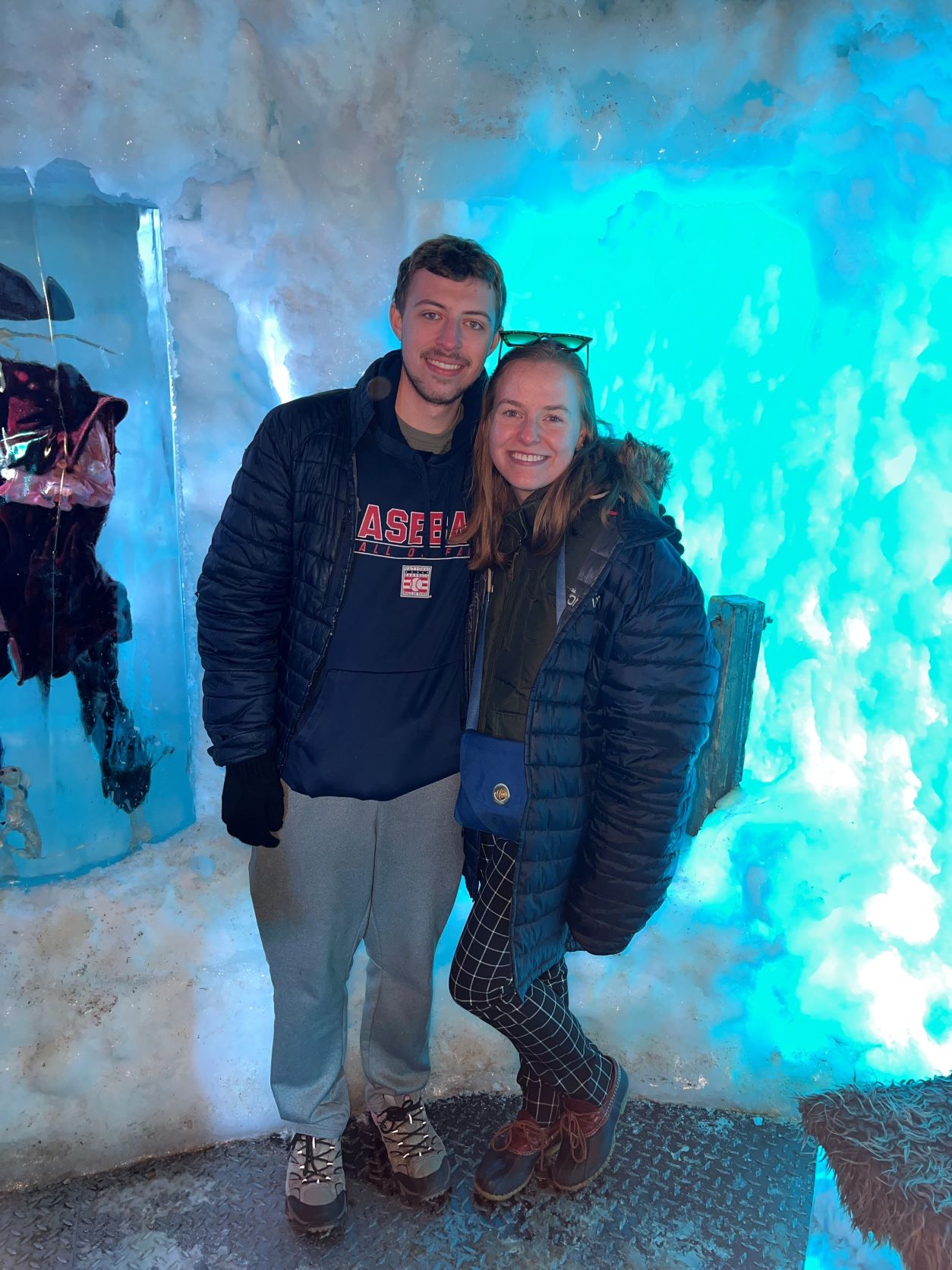 Nate Hood poses with a friend in an ice cave