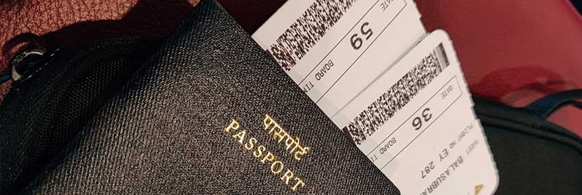 Stock photo of a passport with tickets sticking out of it