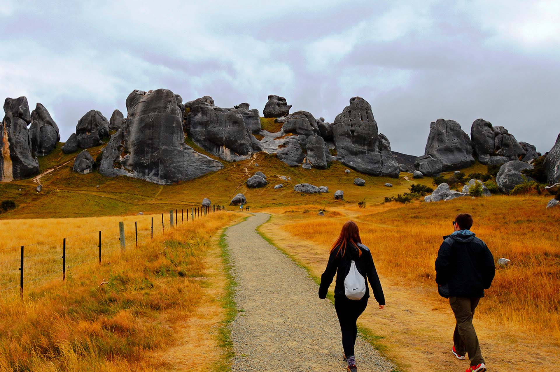 Students walking towards rocks