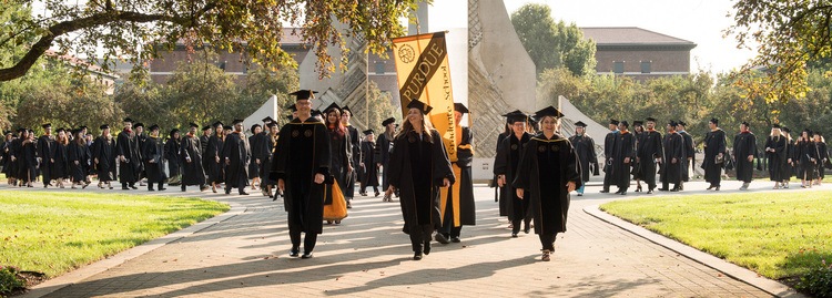 Graduates walking at commencement
