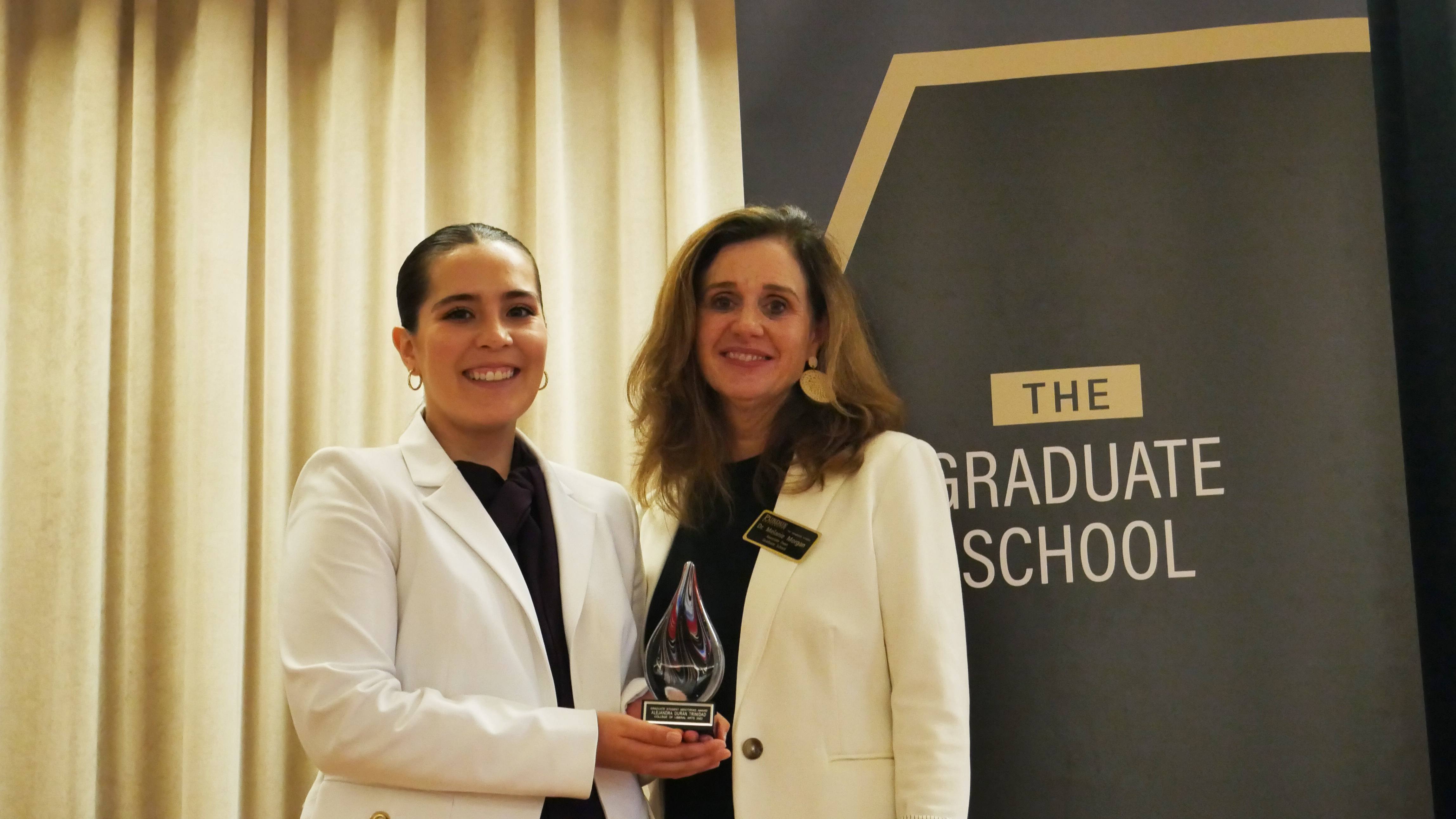 Alejandra Durán Trinidad (left), a Ph.D. Student in the Brian Lamb School of Communication and winner of the 2022 Mentoring Award for Graduate Students poses with her mentor, Dr. Melanie Morgan (right)