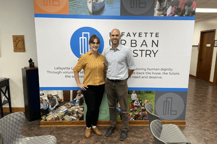 PhD student, Andrea Ens (left) poses with Lafayette Urban Ministry Executive Director, Wes Tillet (right)