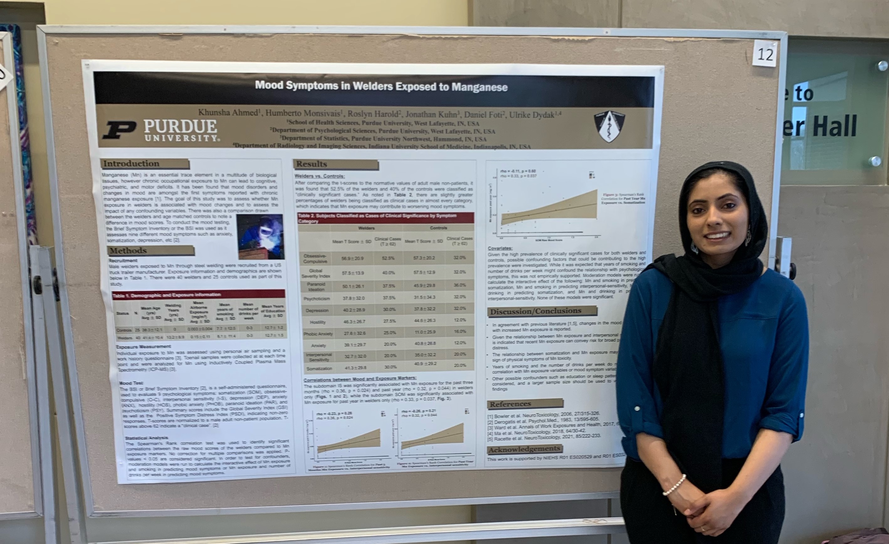 Photo of Khunsha Ahmed and her poster she presented.