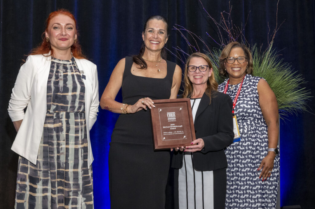 Dr. Cerdiwyn King, head and professor of Purdue's White Lodging-J.W. Marriott, Jr. School of Hospitality and Tourism Management, and Vicki Wicks, general manager at the Union Club Hotel, accept the McCool Breakthrough Award honoring transformative partnerships at the 2025 International Council on Hotel, Restaurant, and Institutional Education Global Conference held in Indianapolis, Indiana.