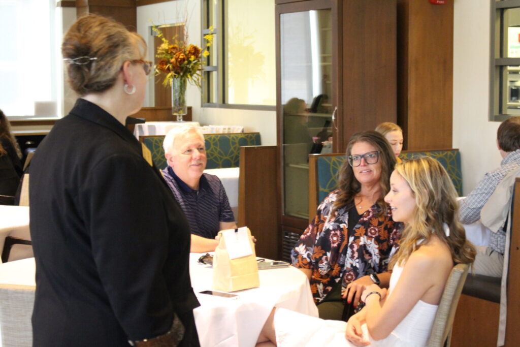 Scenes from Purdue HTM commencement and reception featuring graduates from undergraduate, master’s, and PhD programs.