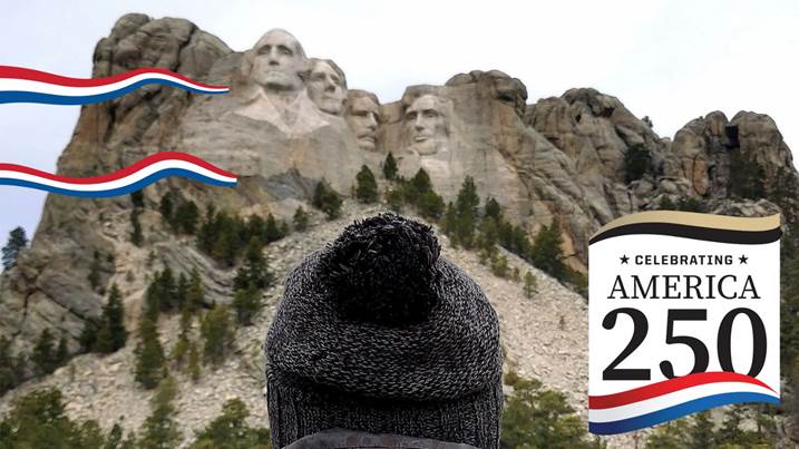Tourist observing Mount Rushmore