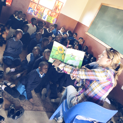 Annie Elble reading to a group of children