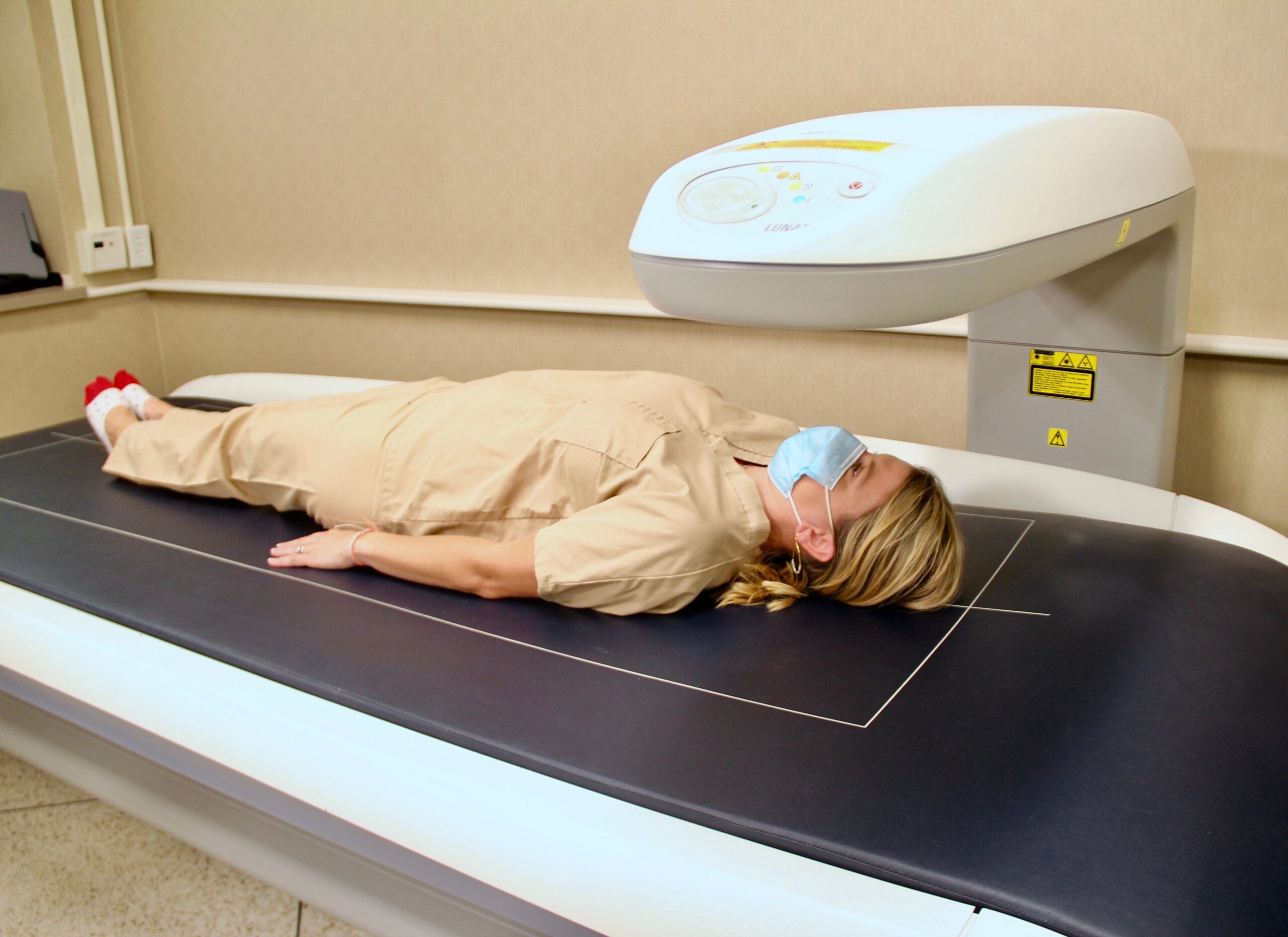 Amy Wright poses on the DEXA body scanner in the Nutrition Science Clinical Research Center