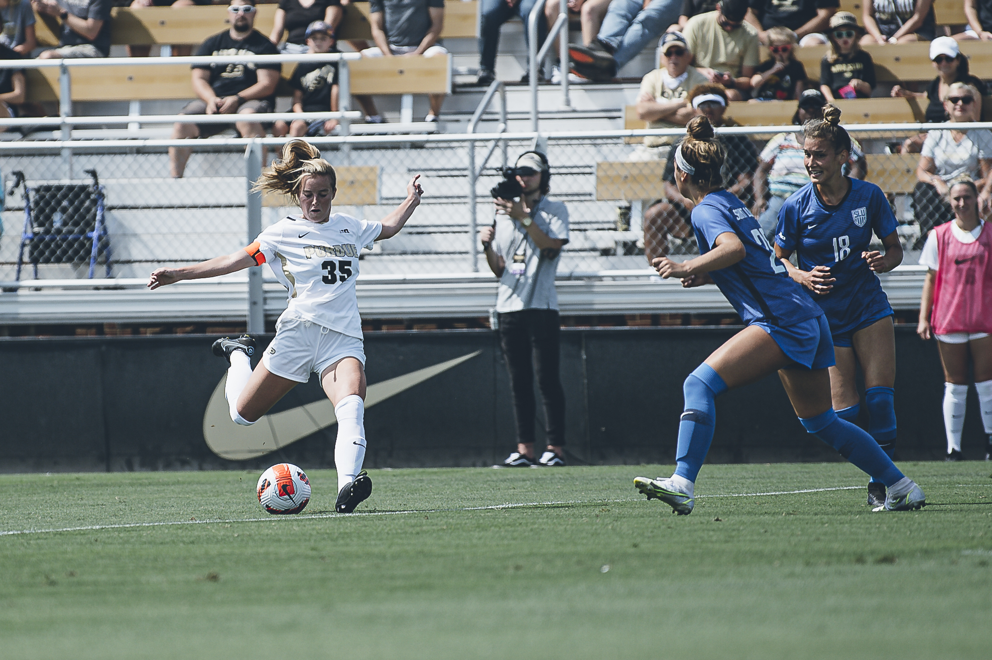 Sarah Griffith prepares to kick the ball past opponents during a Purdue soccer match.