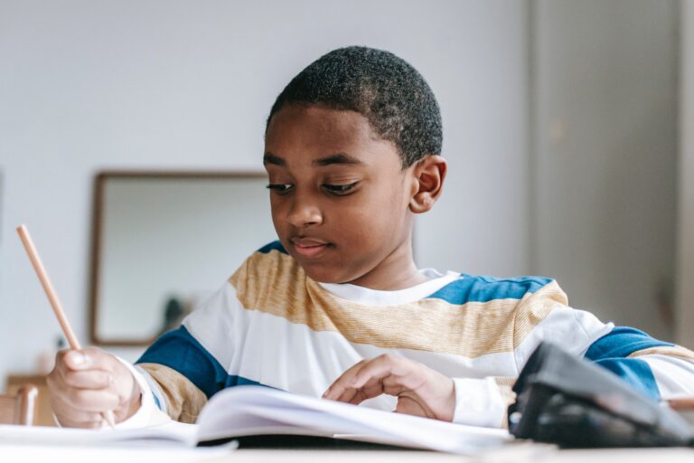 A young boy works on homework