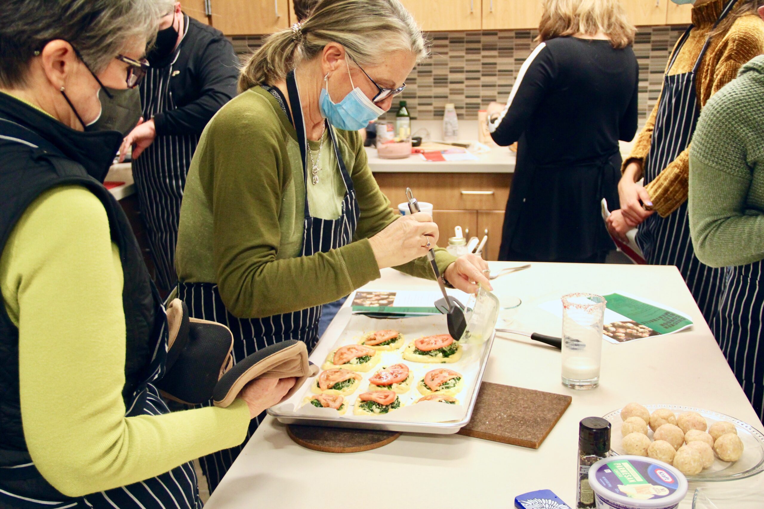 Participants prepare spinach and feta galettes