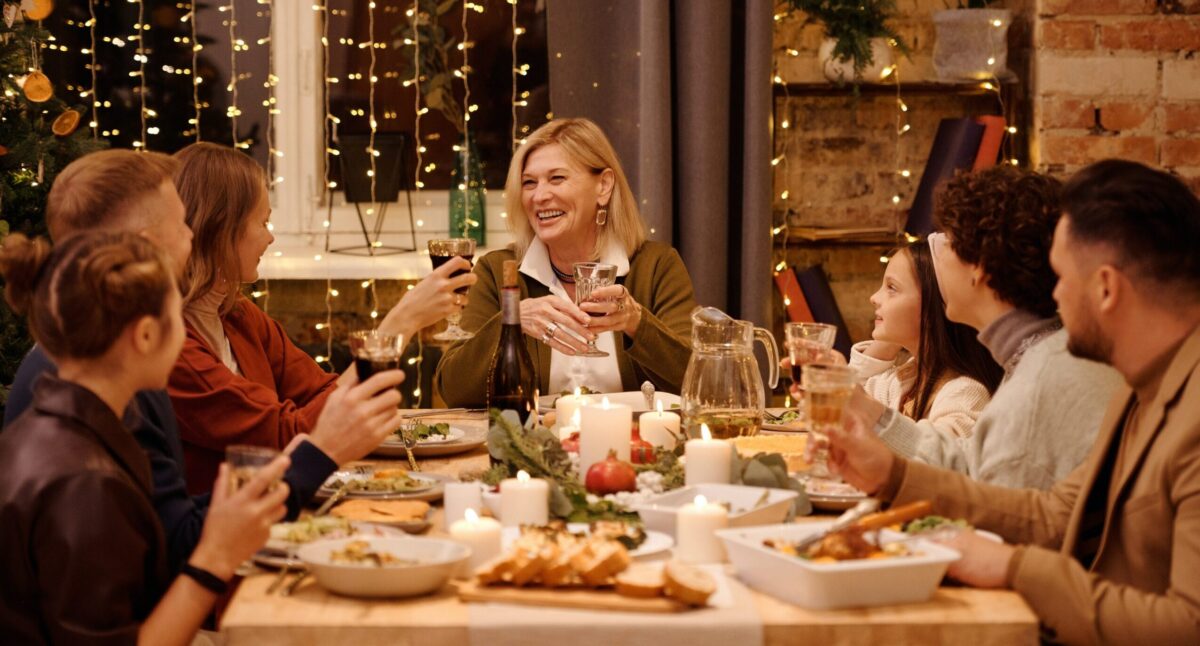 Family sitting down for dinner (Pexels, Nicole Michalou)