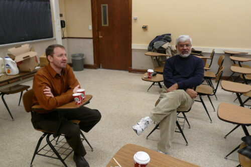 Singh sits with former professor Duane Wegener to listen to a presentation