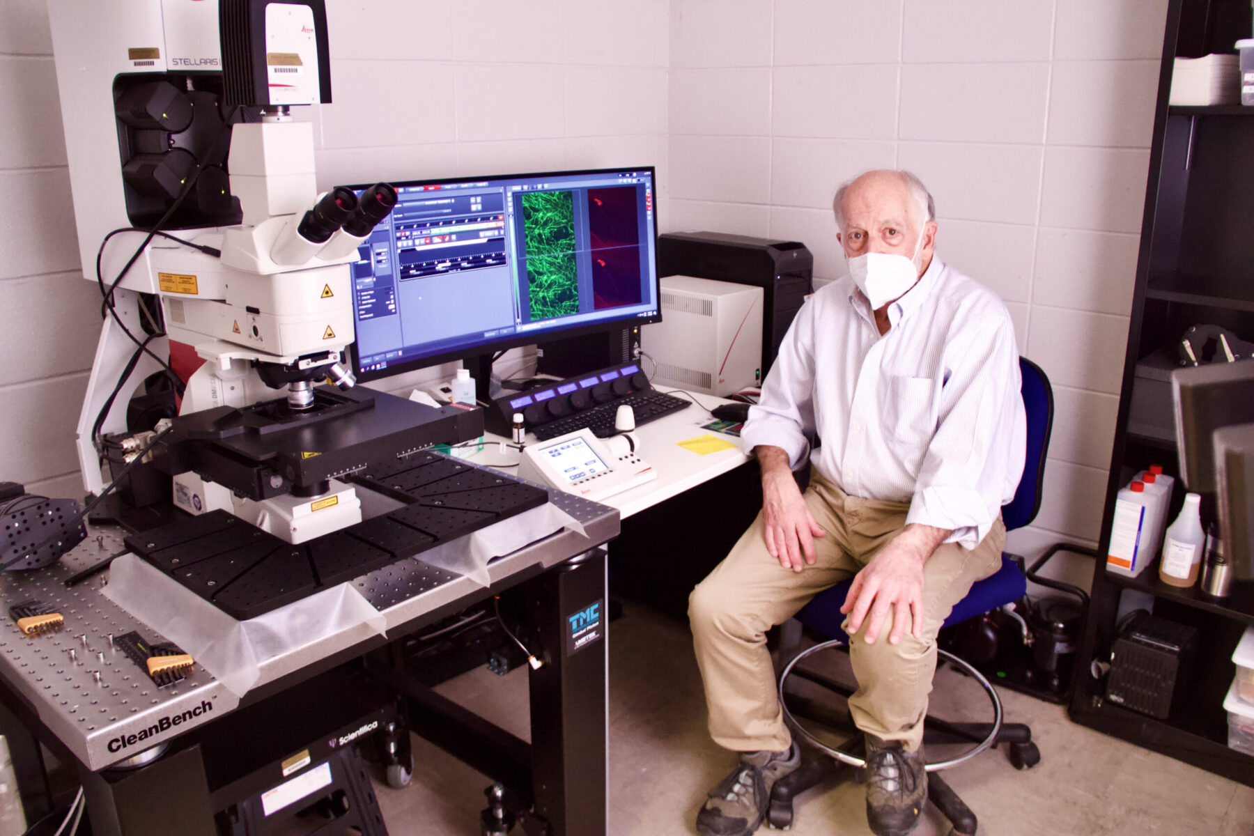 Professor Terry Powley sits in front of a powerful microscope he uses to study the vagus nerve.