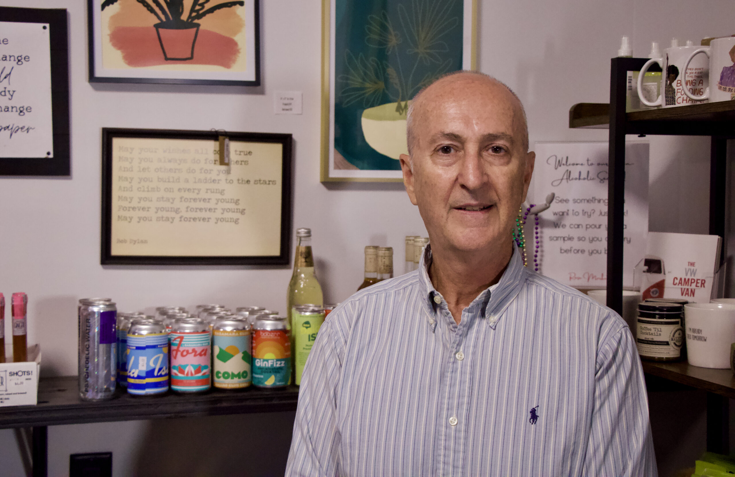 Professor Rodney Runyan stands in front of some shelves in Rose Market.