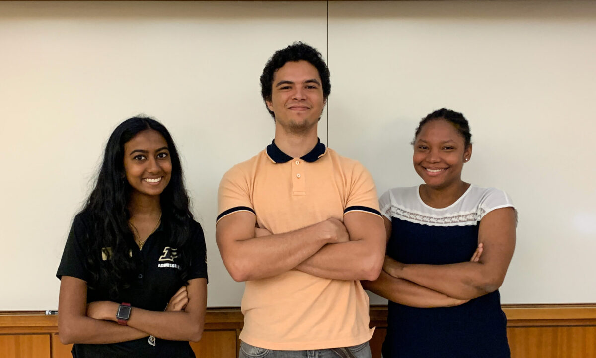 LSAMP students Ramya Anbarasu, Asher Denny and Christelle Altidor pose for a photo in a classroom
