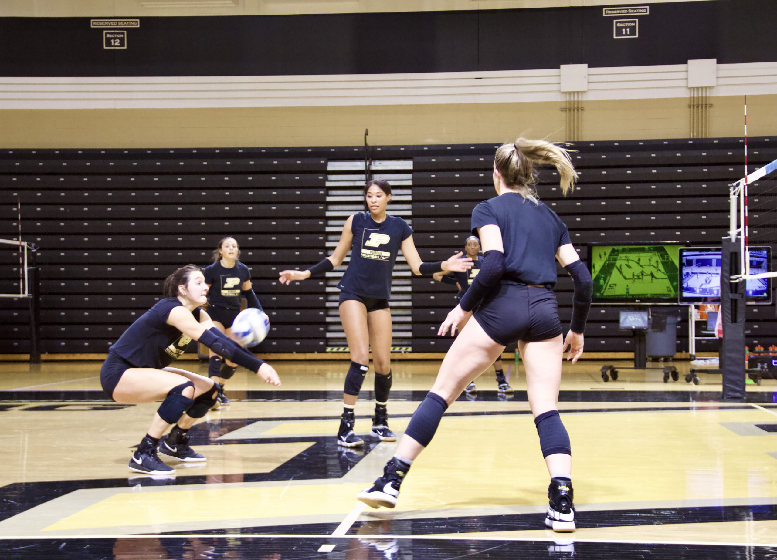 Eva Hudson passes the volleyball at a recent practice