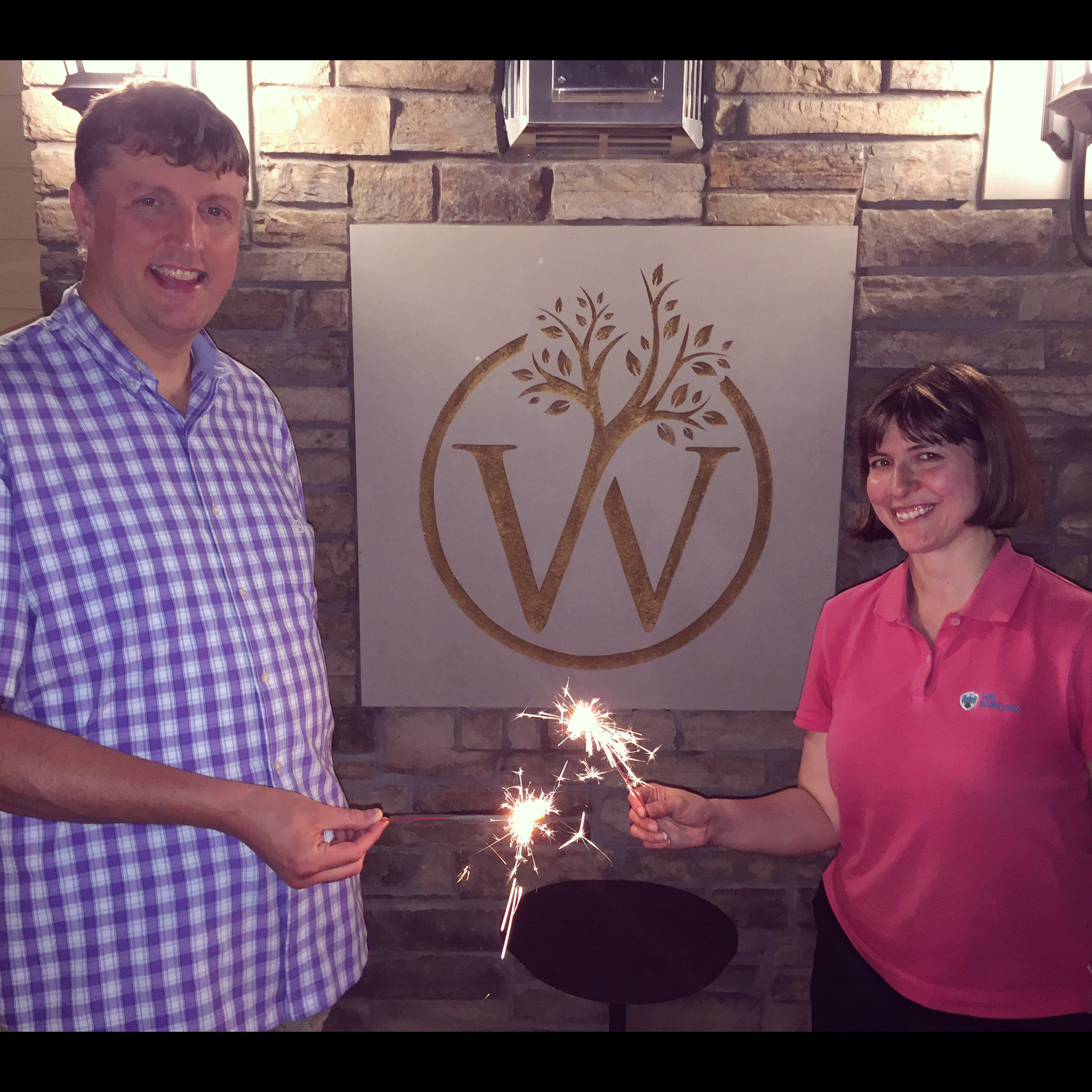 Andrew and Elizabeth Whittaker light sparklers outside of their small West Lafayette hotel, The Whittaker Inn.