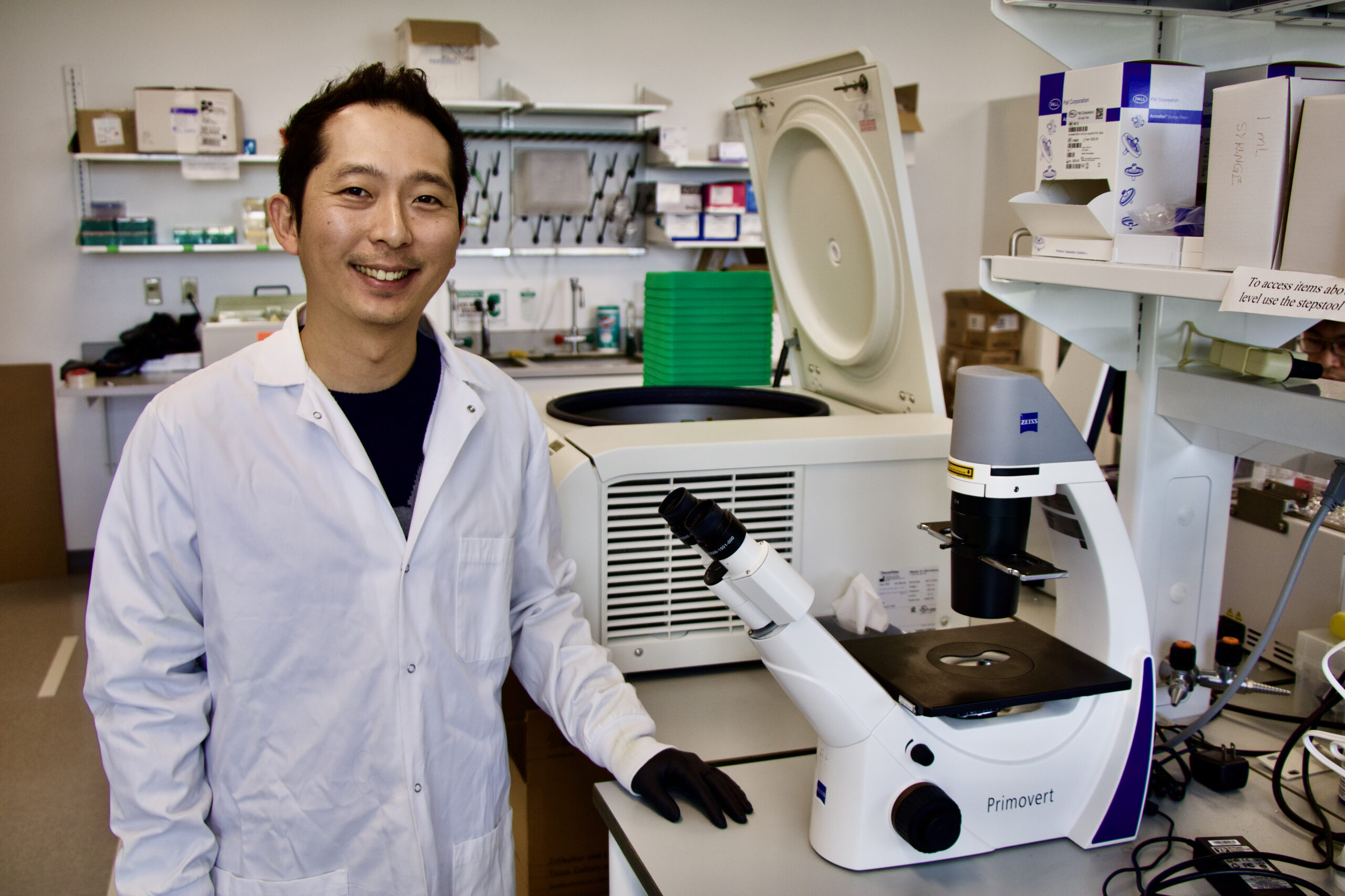 Hyunjin Kim poses for a picture in a science lab.