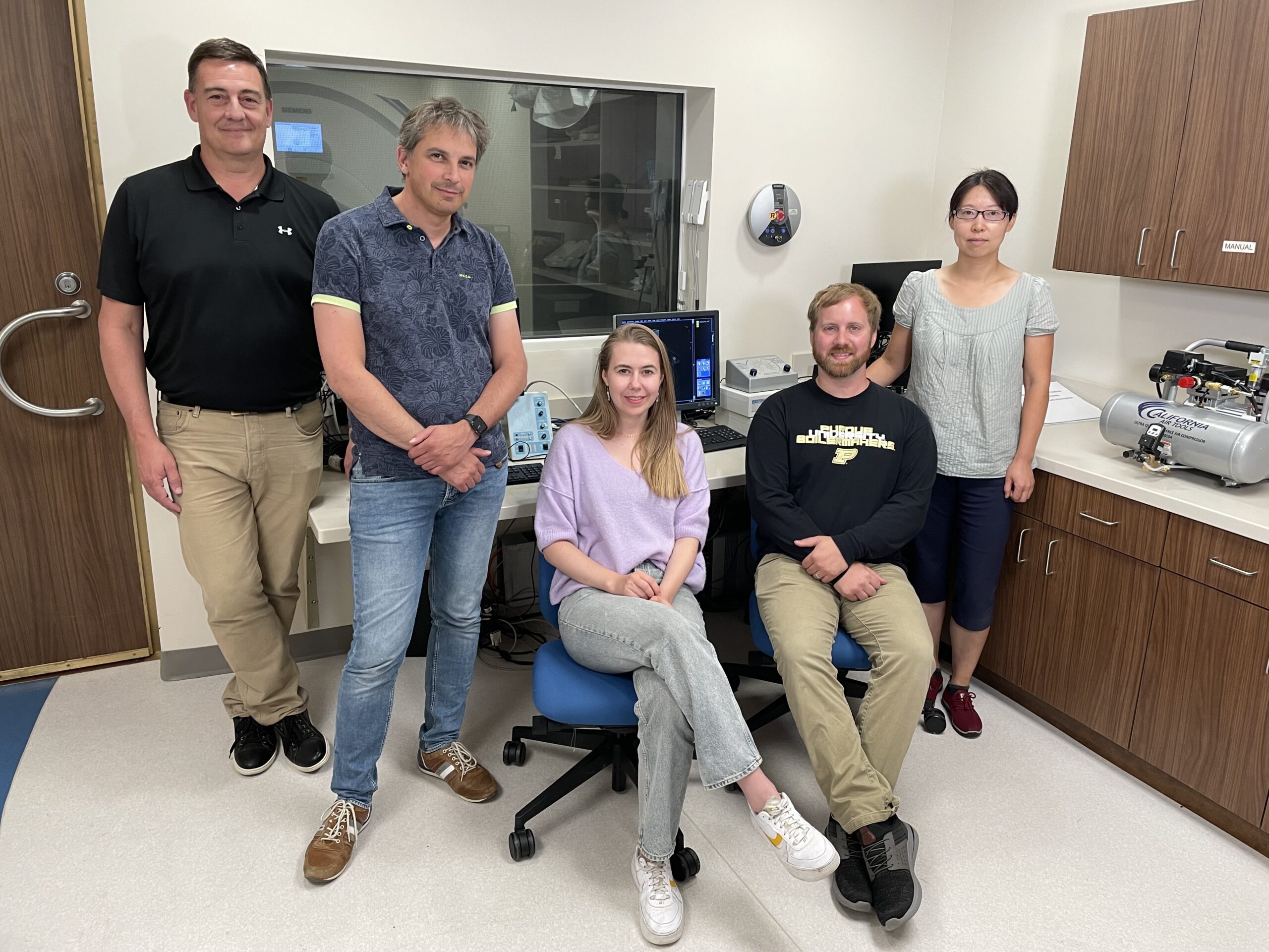 Researchers pose for a picture in the Purdue Life Science MRI Facility.