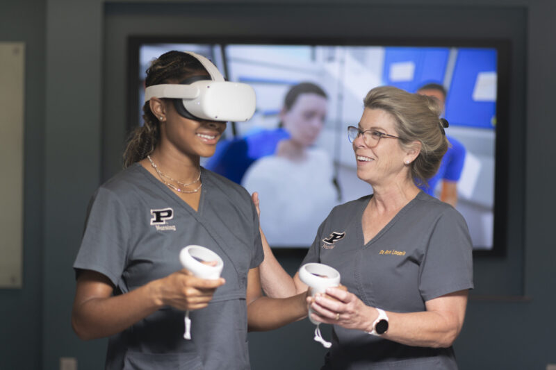 Nursing students wear the VR headsets, taking part in one of the simulations