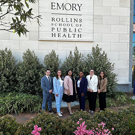 The students on the competition team pose in front of Emory's Rollins School of Public Health.