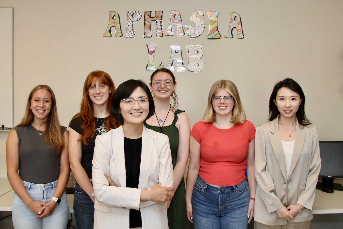 Jiyeon Lee and student researchers pose for a photo in the Purdue Aphasia Lab