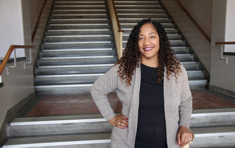Kayce Solari Williams poses for a picture inside Matthews Hall.