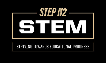 Research audiologist Alex Hustedt-Mai tests Purdue President Mung Chiang’s hearing at the APARC grand opening in Indianapolis.