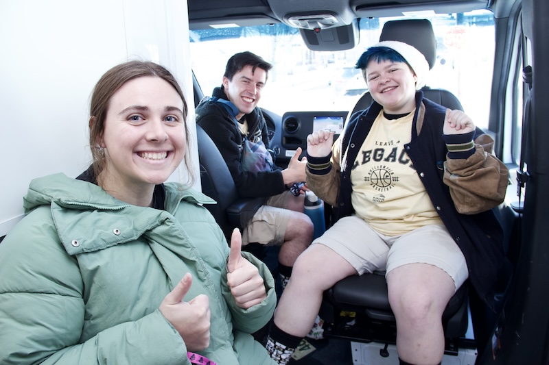Participants celebrate another basketball victory postgame in the APARC van.