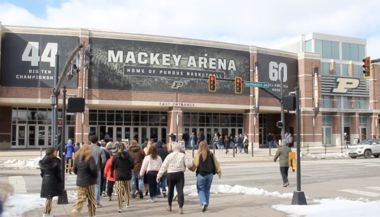 The crowd starts to file into Mackey Arena's main entrance.