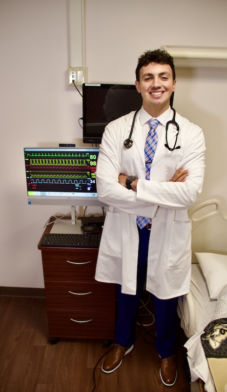 Tyson Magee poses for a picture in the Purdue Nursing simulation lab.