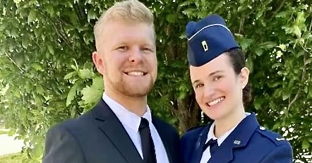 Abby Badinghaus poses for a picture in uniform with her husband, Matthew Badinghaus.