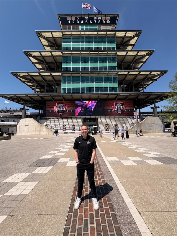 Molly Wendel stands on the Indiana Motor Speedway finish line.