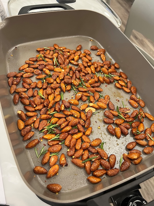 A pan of rosemary chili almonds cooks up at a Steps to a Healthy You meeting.