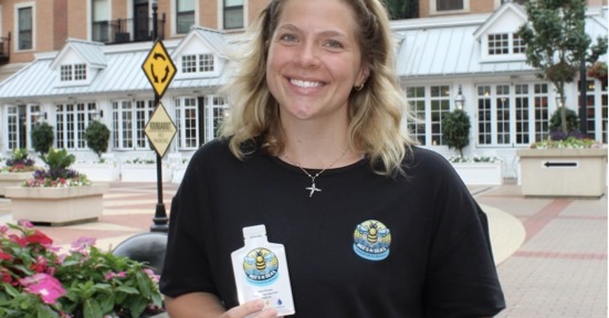 Sarah Molander poses for a picture while holding a packet of BEE'S N SEA'S.