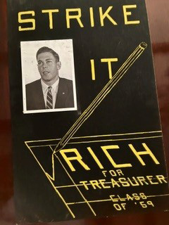 A gold and black flyer with the words "Strike it Rich for Treasurer."