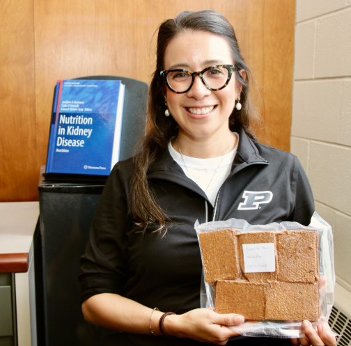 Annabel Biruete holds a package of milpa crackers shipped from Mexico.