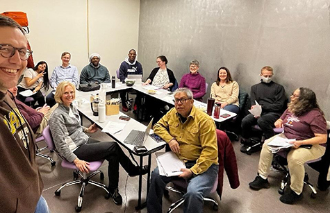 Members of a Northwest Indiana environmental community advisory board at a meeting table.