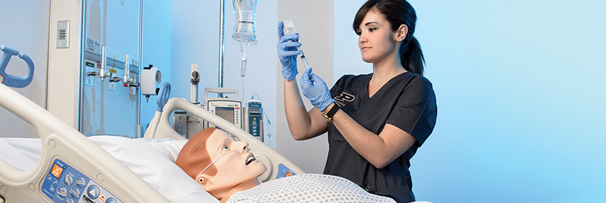 Nursing student student practicing on synthetic patient