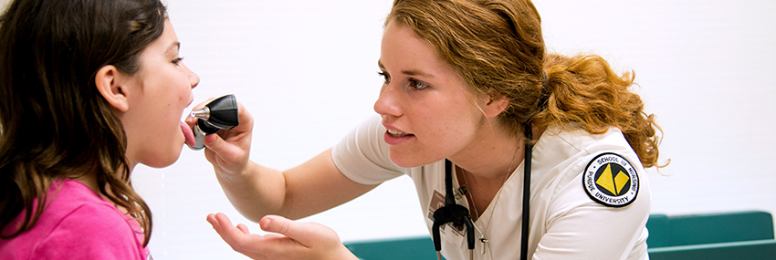 Nursing student student examining patient