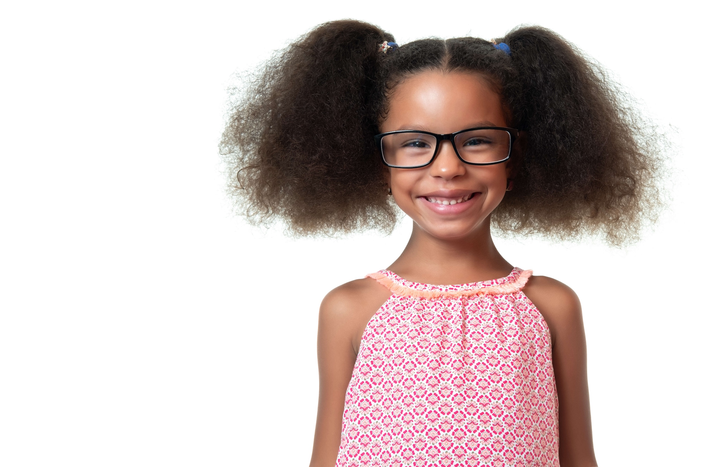 young African American girl wearing glasses and smiling