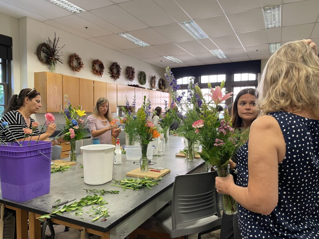 Attendees arranging flowers