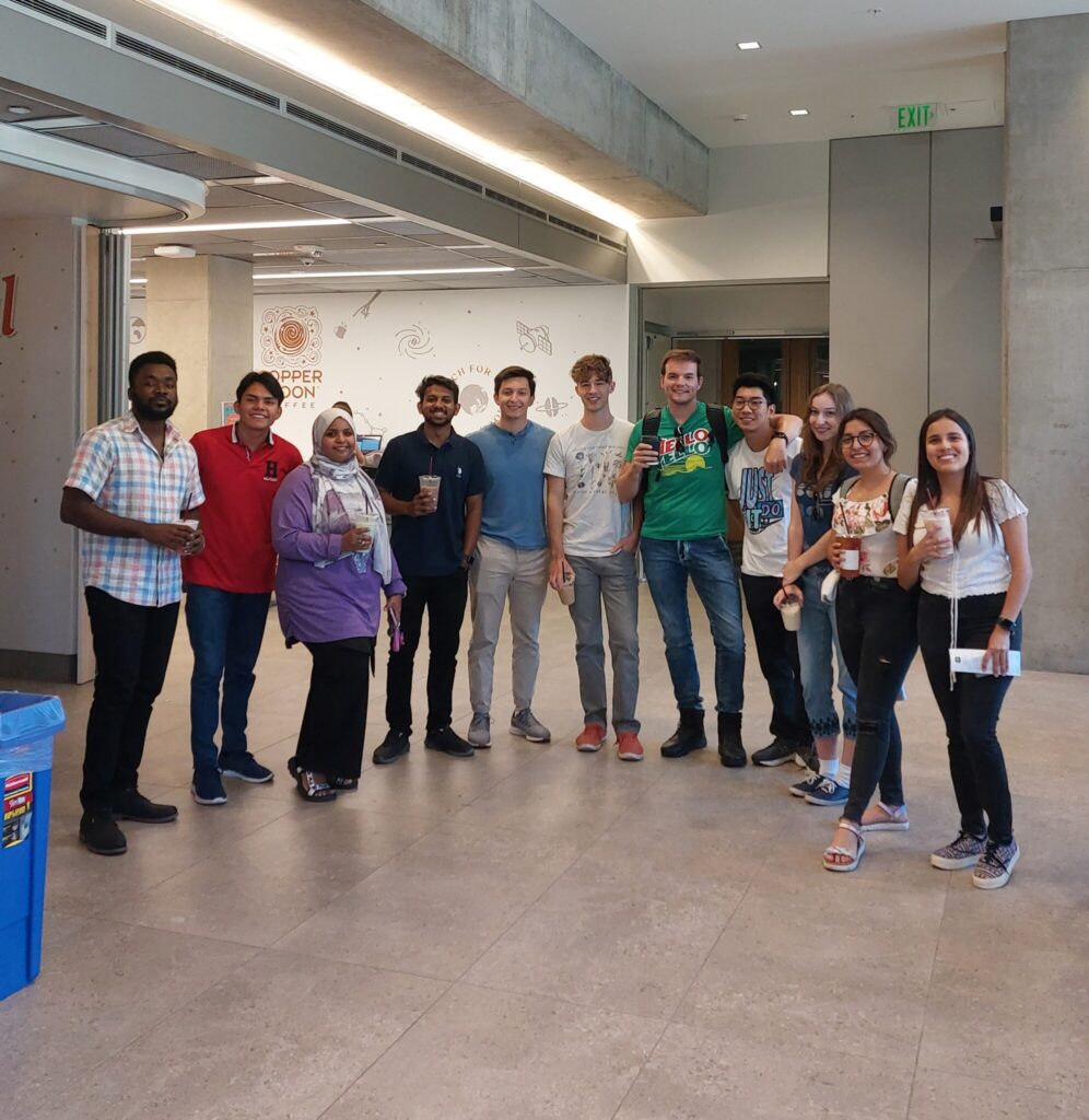 Graduate Students posing with their coffee