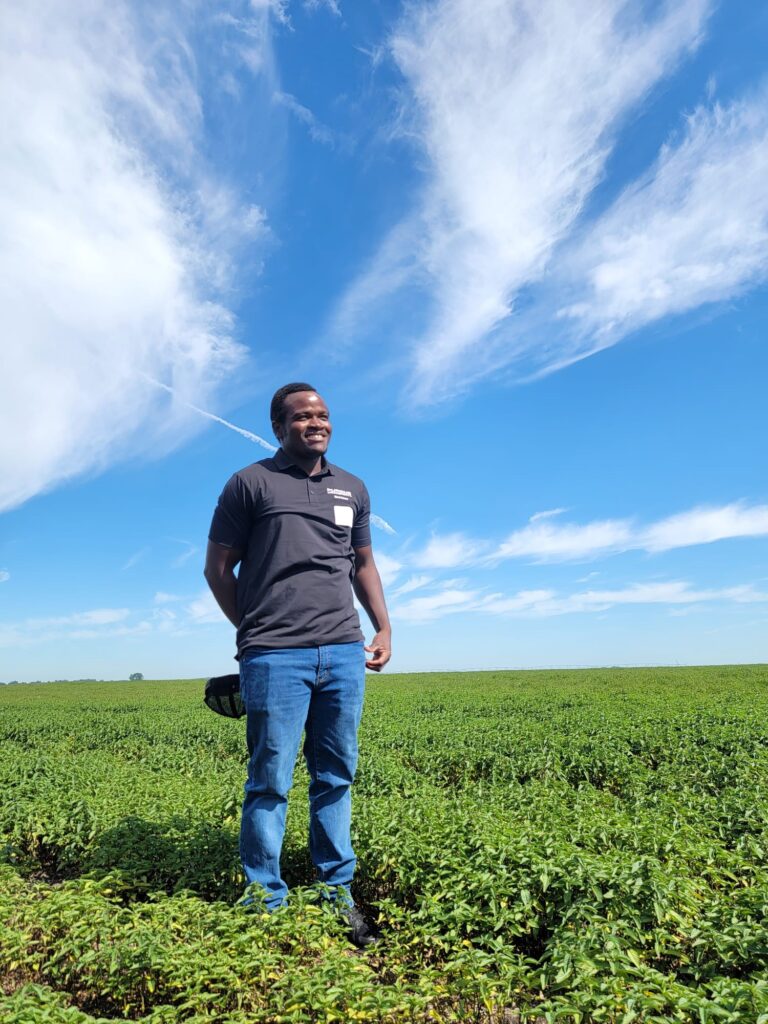 Photo of Emmanuel Cooper in a mint field