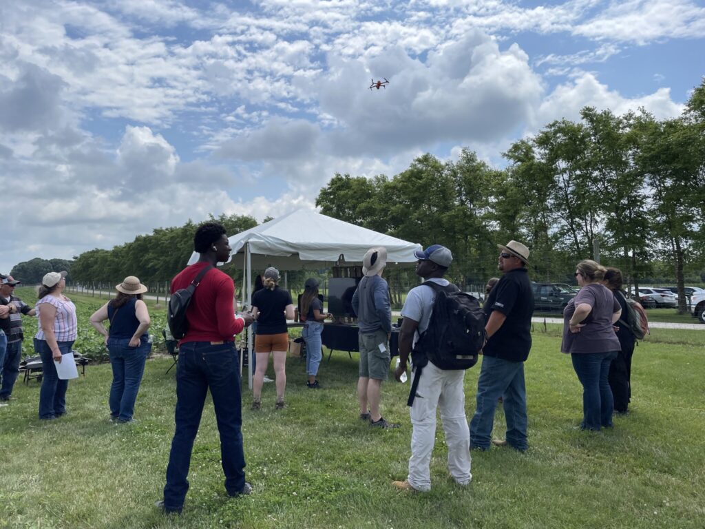 Attendees watch an UAV demonstration.