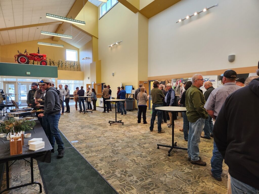 Indiana Organic Grain Farmer attendees milling about the front lobby.