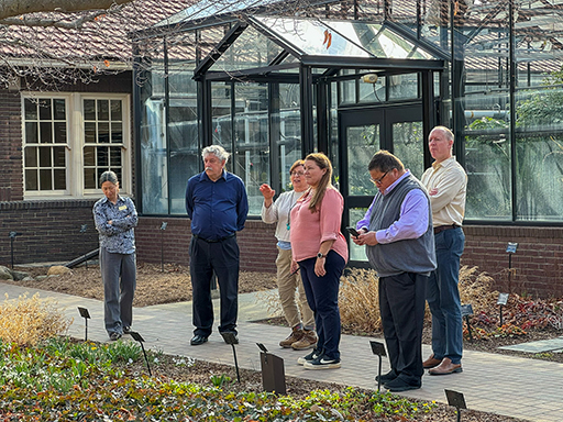 Karen Sullivan showing the external review members the Jules Janick Horticulture Garden.