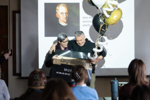 Steve Hallett and his partner holding the congratulations sign.