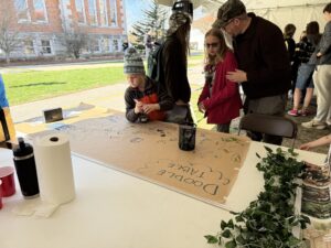 Children at the PASLA's doodle table at Spring Fest